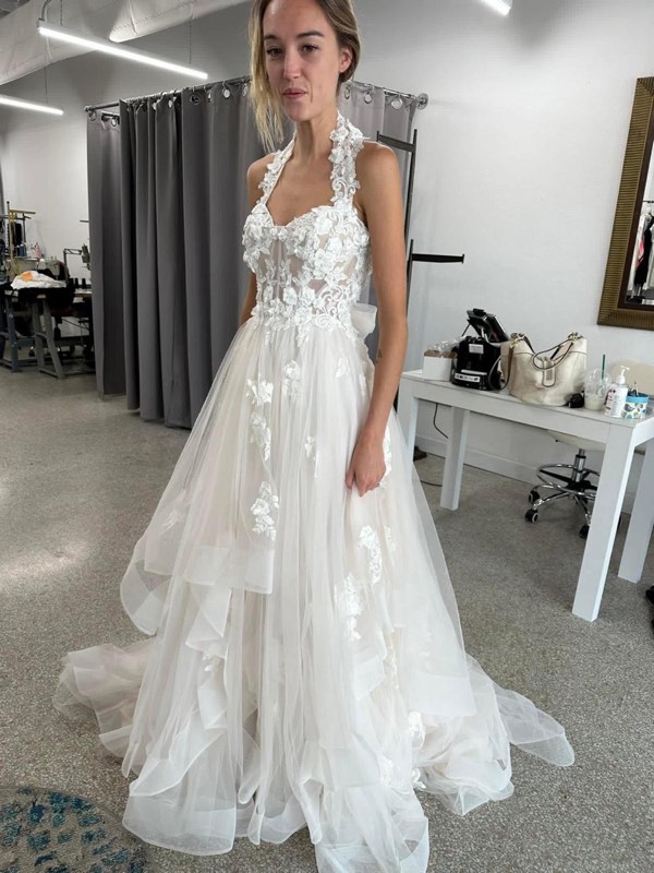 Halter wedding gown with a tiered skirt