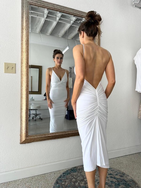 White ruched dress with an open back