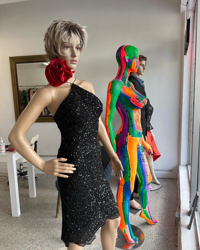 Black sequin dress and painted mannequin in the atelier